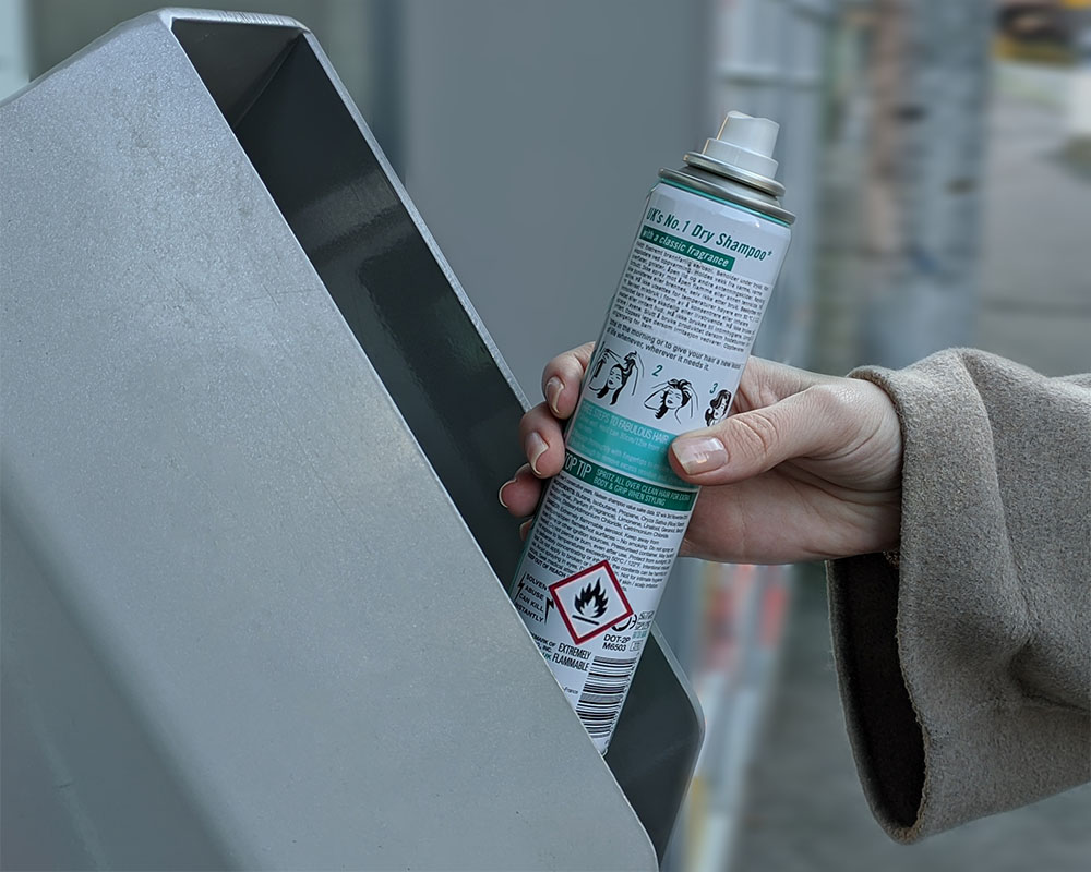 Spraycan being recycled